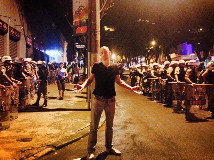A common scene in Brazil during the World Cup. Windows boarded up and riot police everywhere.