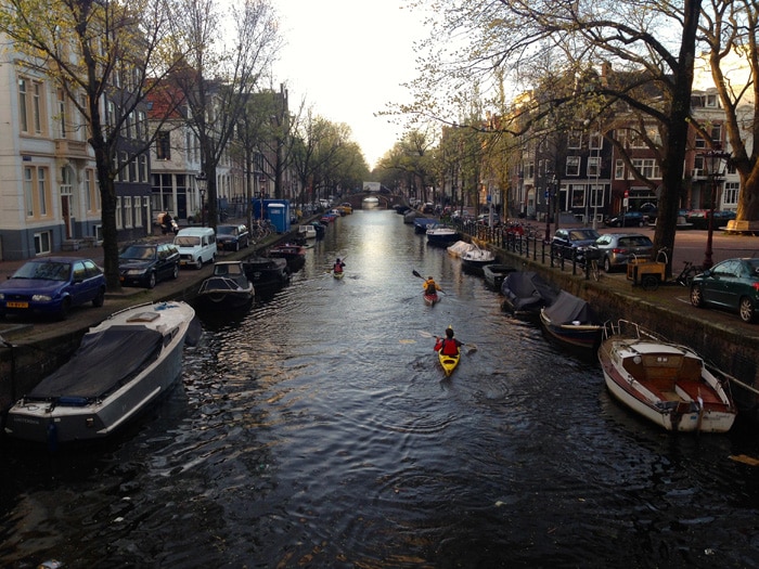 Kayaks on a canal in Amsterdam.