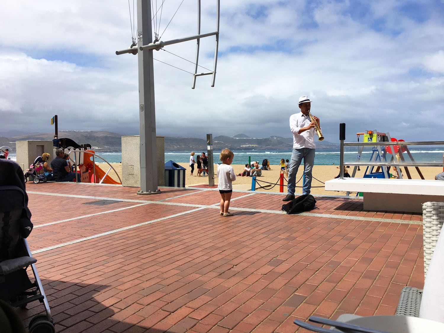 Kid and musician, down by the beach in Las Palmas
