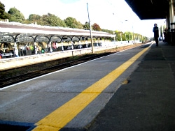 An empty platform at Durham station, one figure at the far end under the canopy