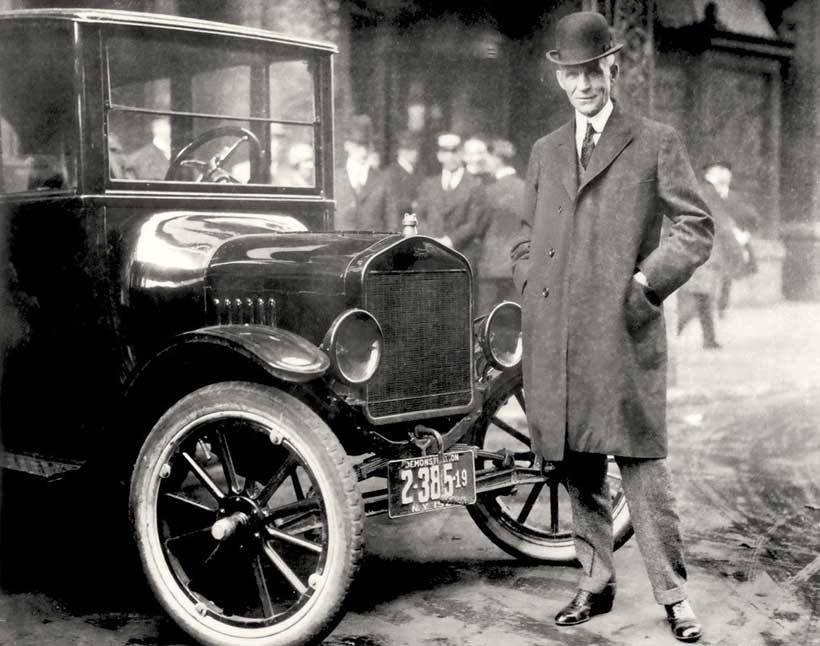 Henry Ford seated at the wheel of a 1921 Model T